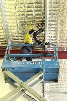 Zero G Arm Being Used On Ewp Electrician